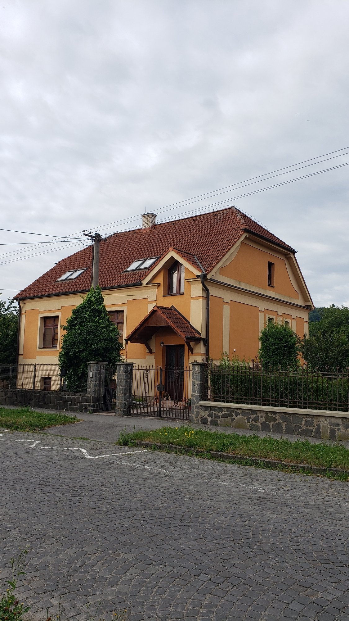 Prešov streets, waterways, and buildings on a quiet July morning