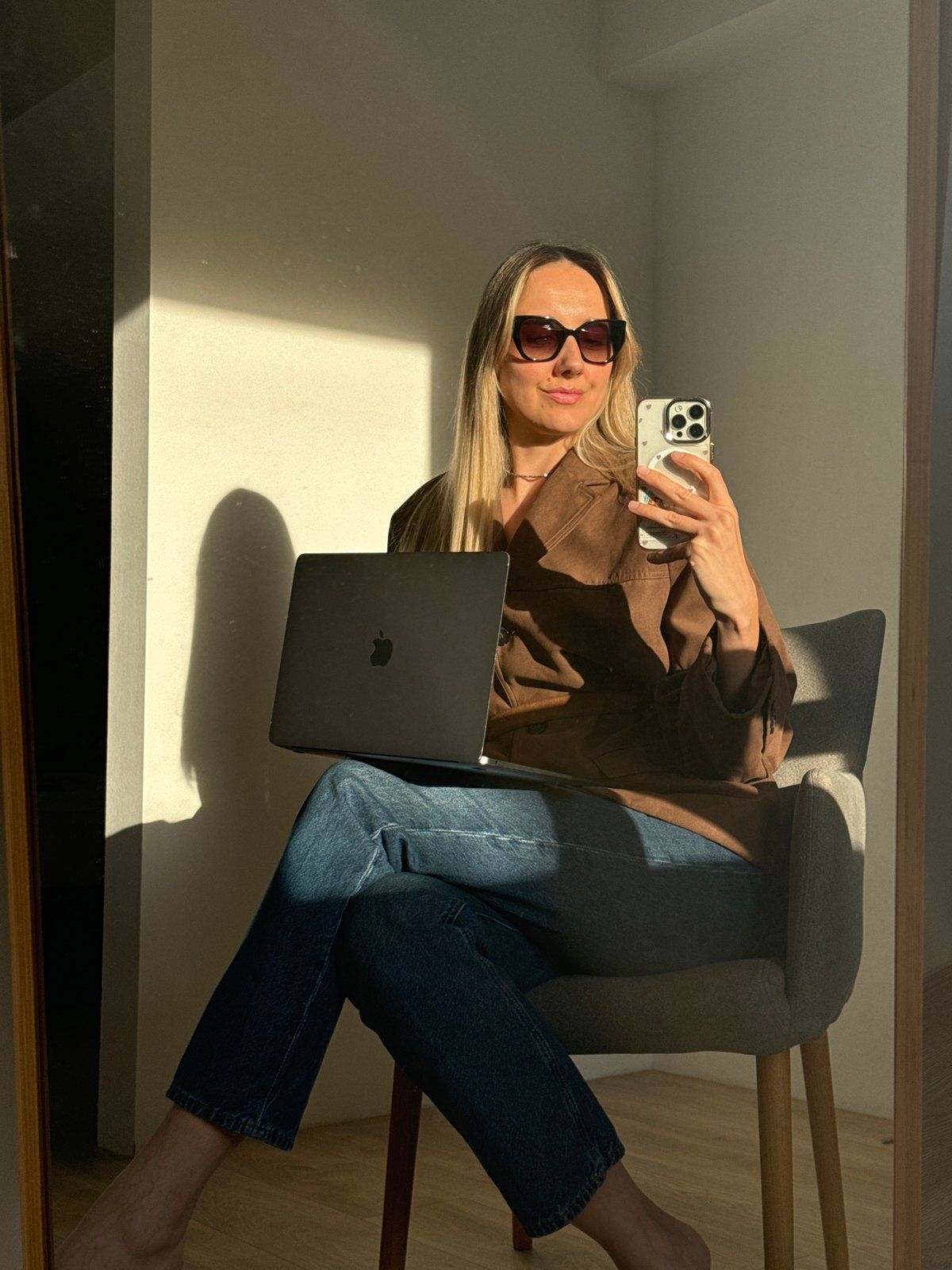 Woman takes mirror selfies indoors in Carnikava, Latvia