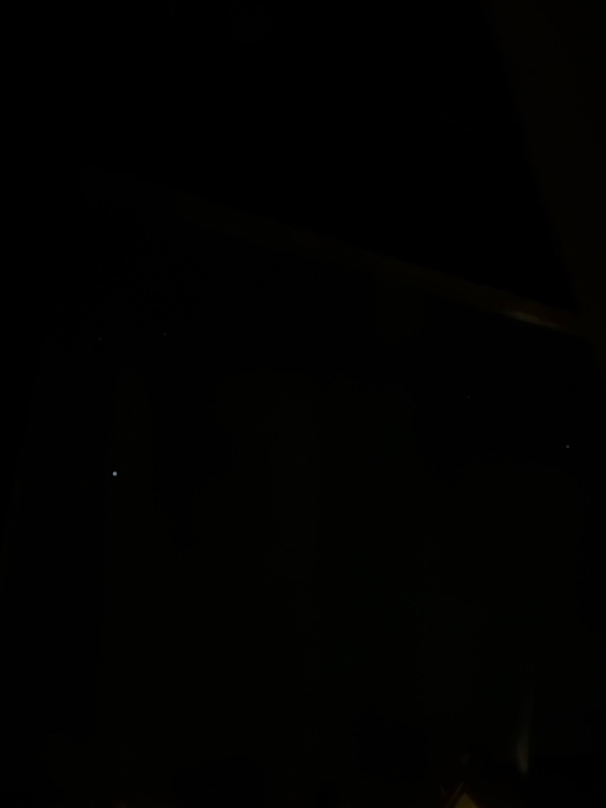 Dark conditions with faint lights observed in Reigate area