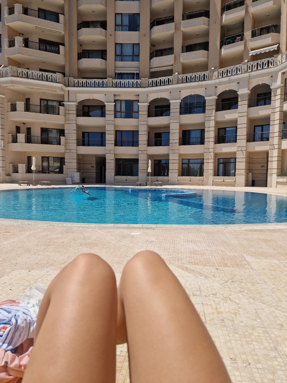 Pool dive captured from patio perspective at morning swim
