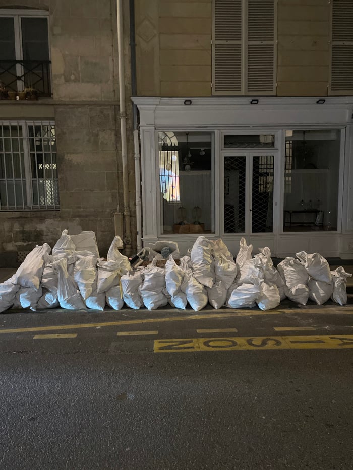 Evening snapshots capture street debris, wall art across Paris