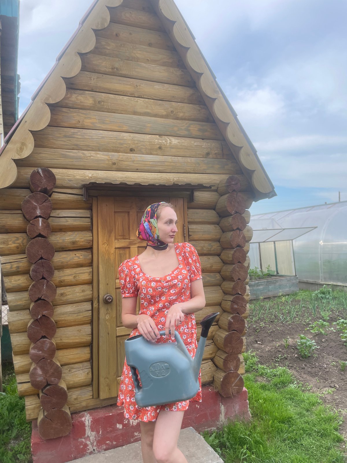 Woman documents rural gardening activities in Kuyeda, Russia