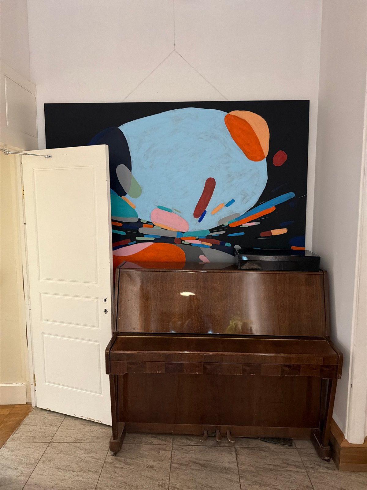 Moscow interior features abstract art and decorative books