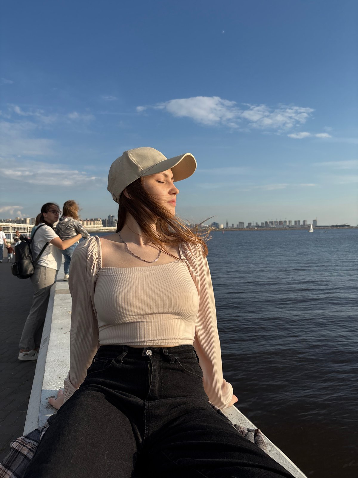 Woman enjoys afternoon by Saint Petersburg waterfront