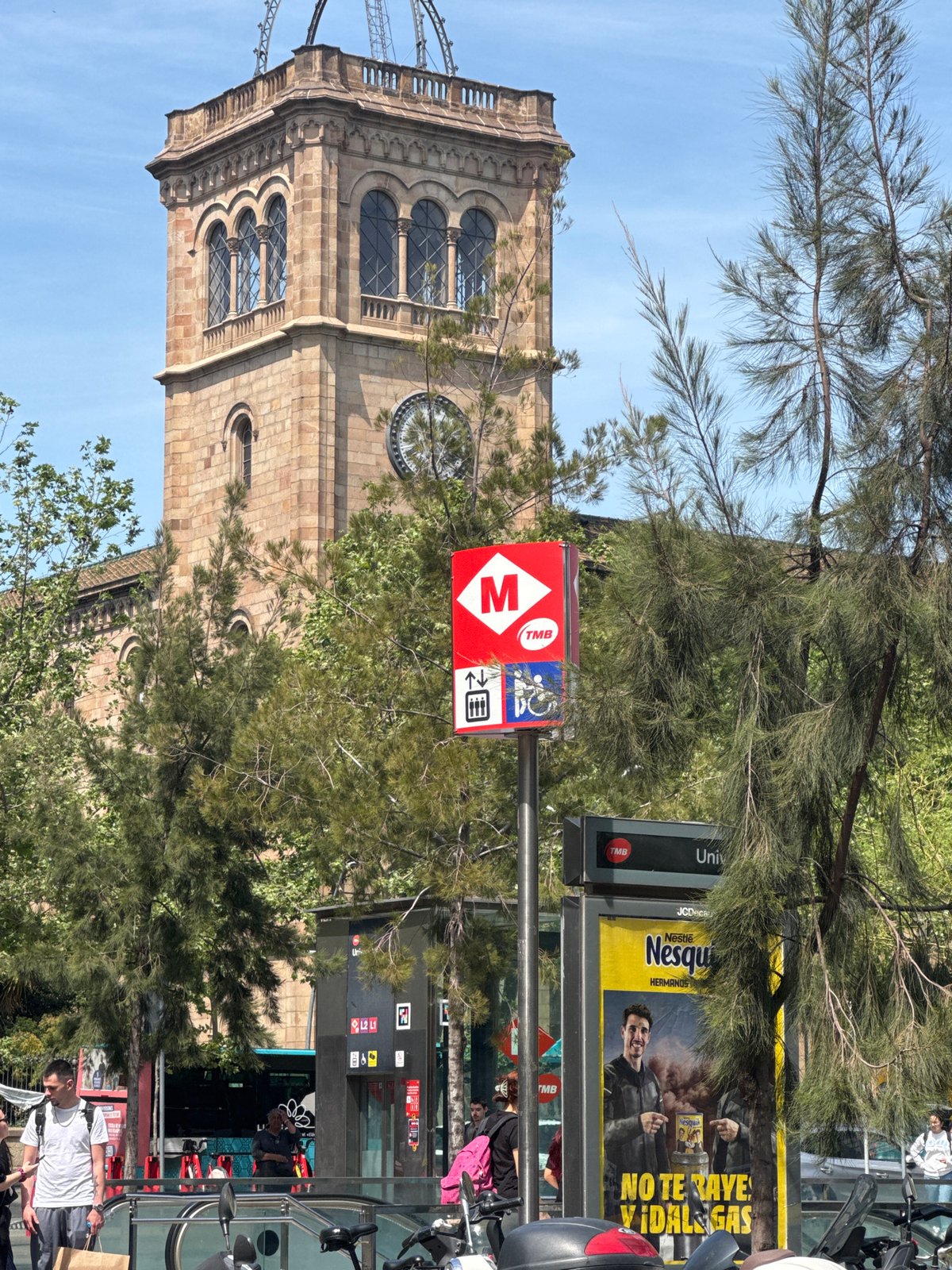 Sunny Barcelona street scene captured near metro station