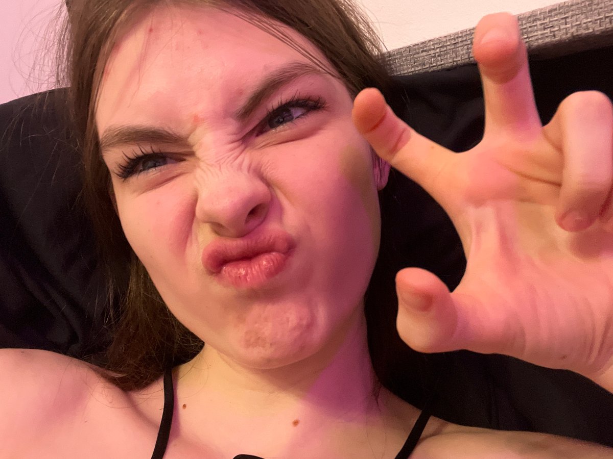 Woman documents evening selfie session with cat in Saint Petersburg