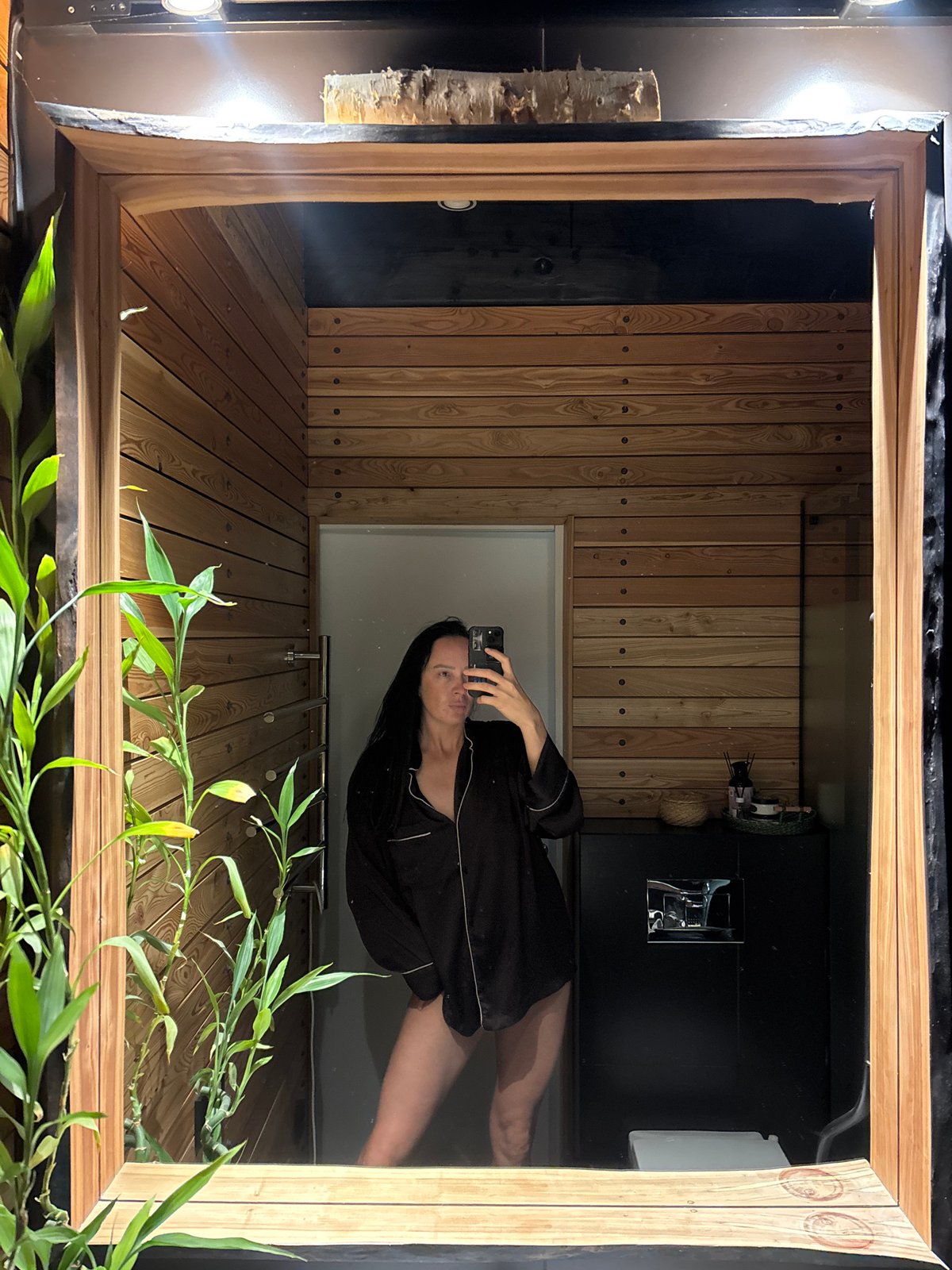 Woman takes mirror selfies in multiple rooms, Chaikovsky