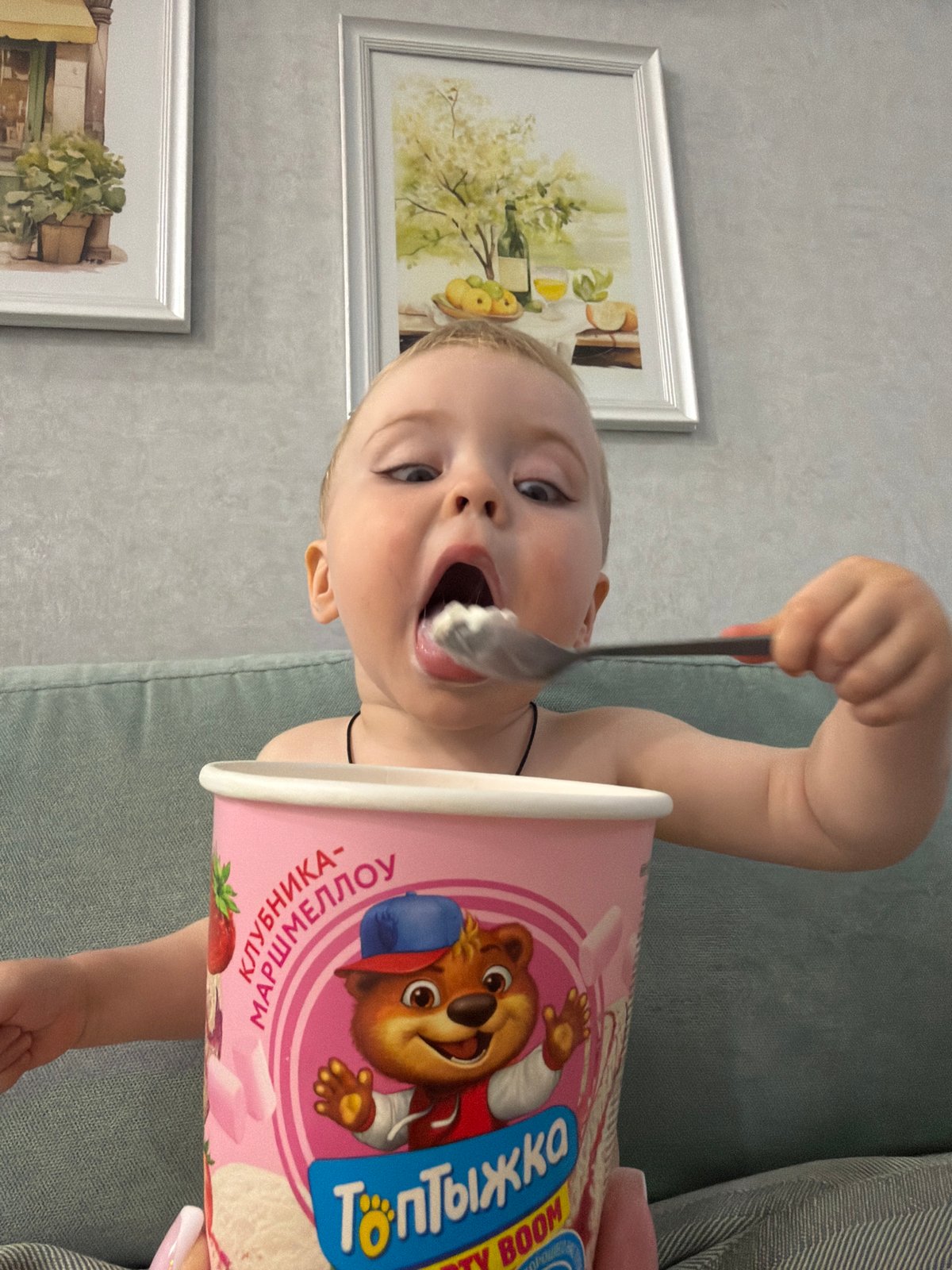 Child enjoys Russian yogurt snack, motorcyclist spotted in Votkinsk