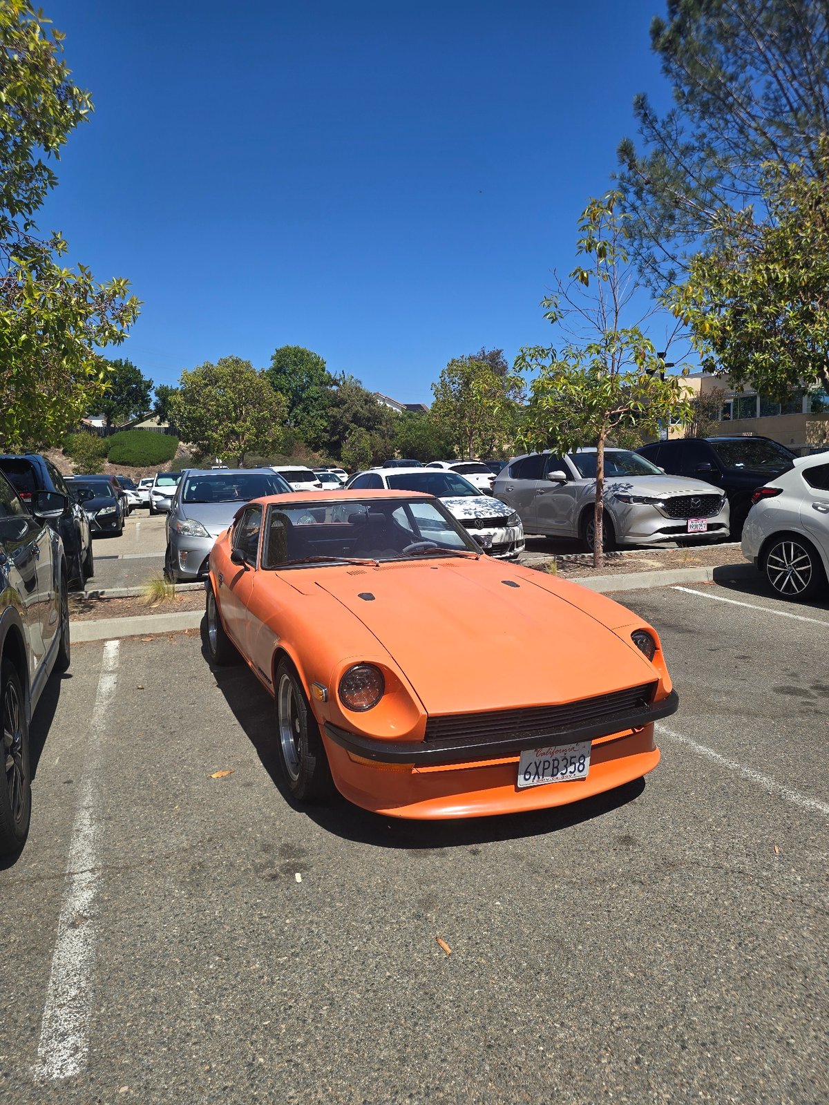 Orange 1970s Datsun 240Z spotted at Encinitas Community Park