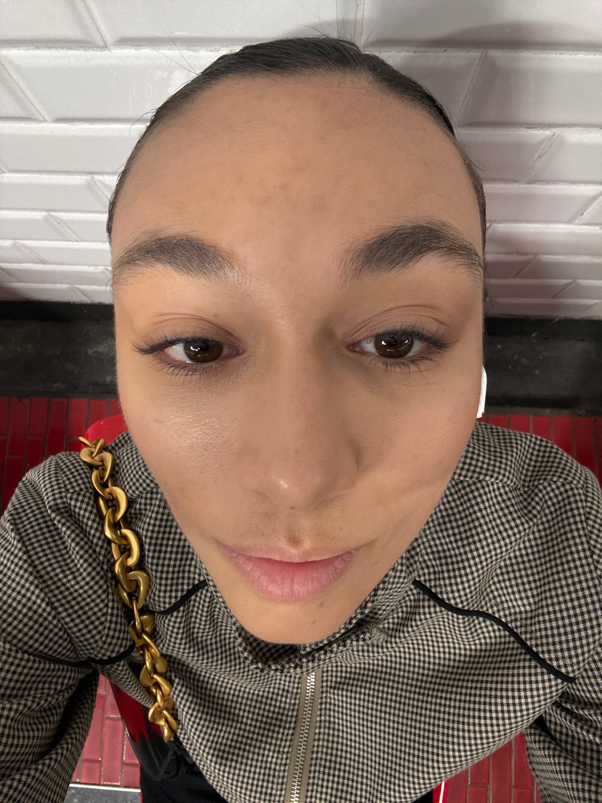 Person takes selfies at Clichy metro station