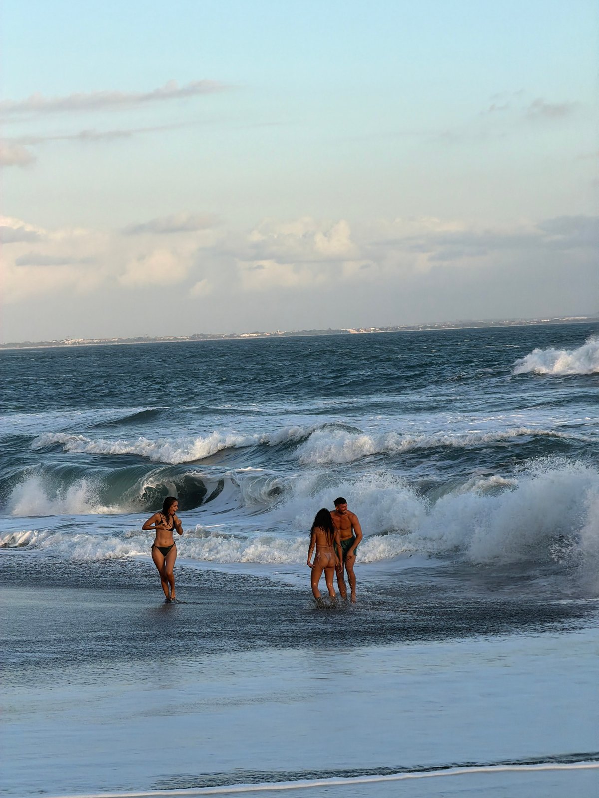Tourists document beach day and temple visits in Mengwi