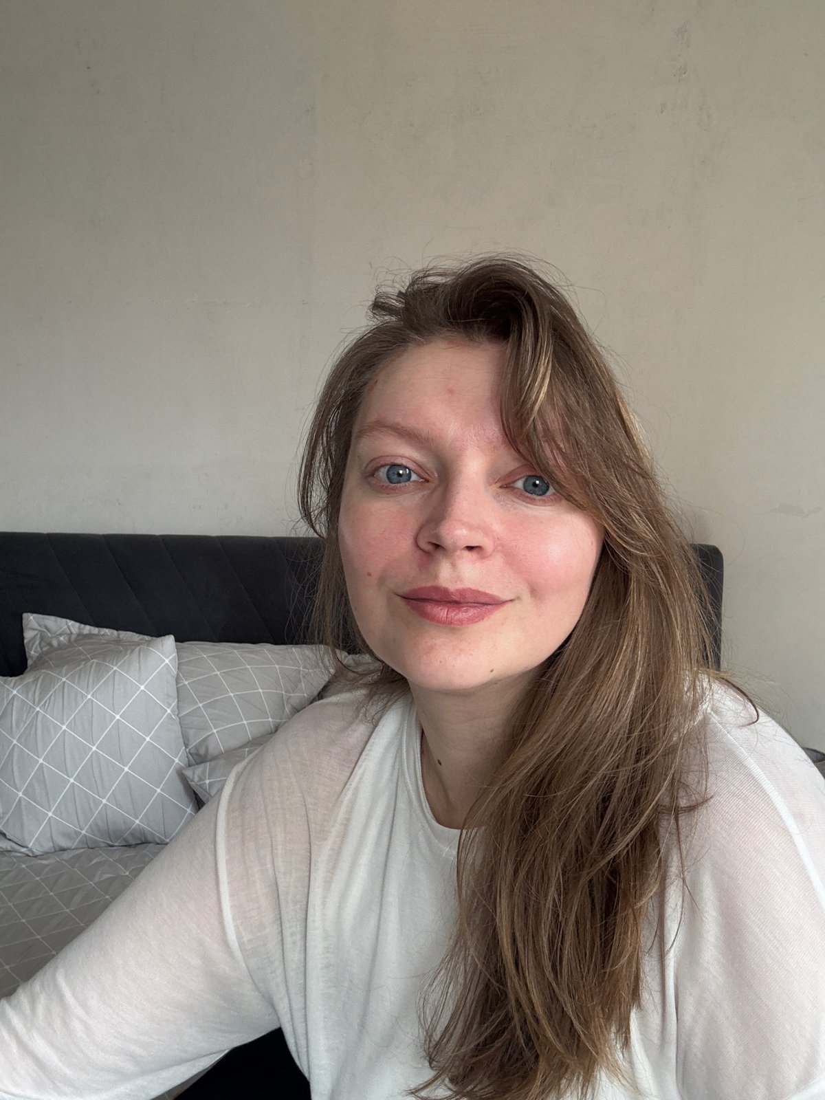 Morning bedroom scenes captured with woman reading, cat by window