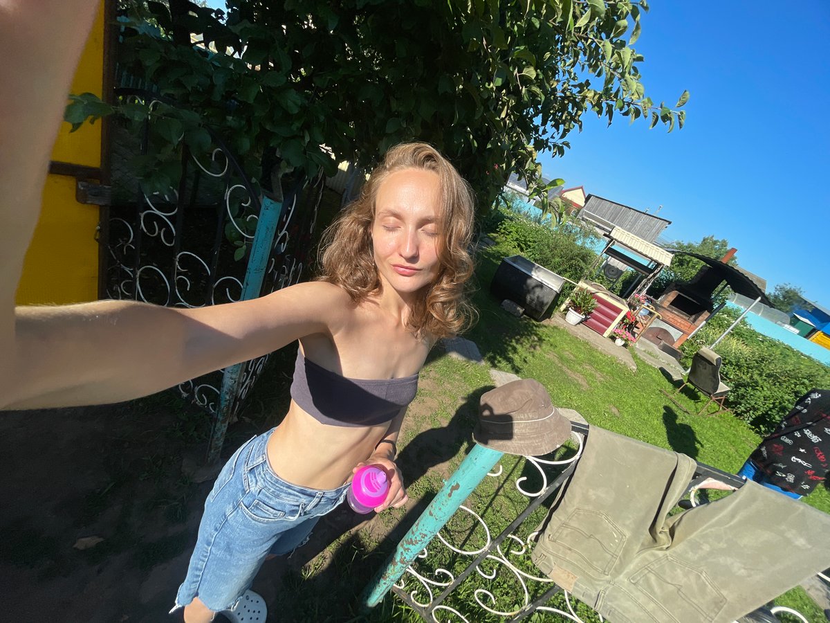 Casual summer selfie session at a backyard dacha in Kuyeda