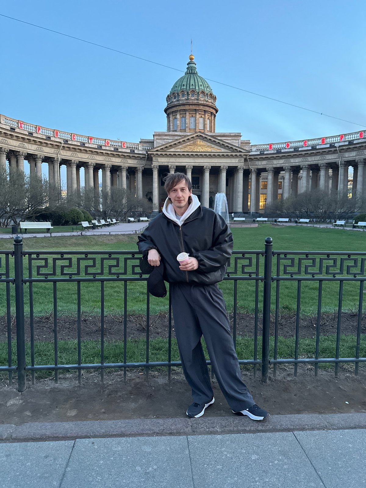 Person rests on fence, floral car spotted in Saint Petersburg