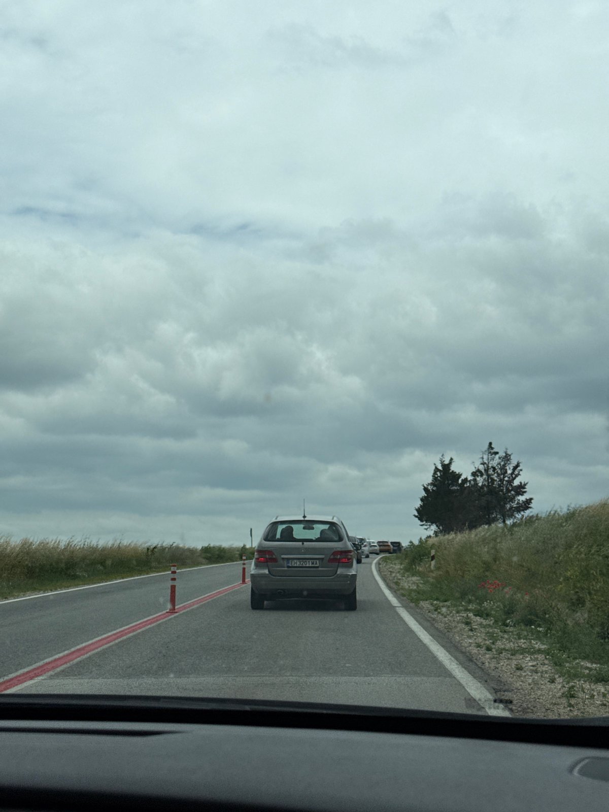 Vehicle travels cone-lined road in Pleven, Bulgaria