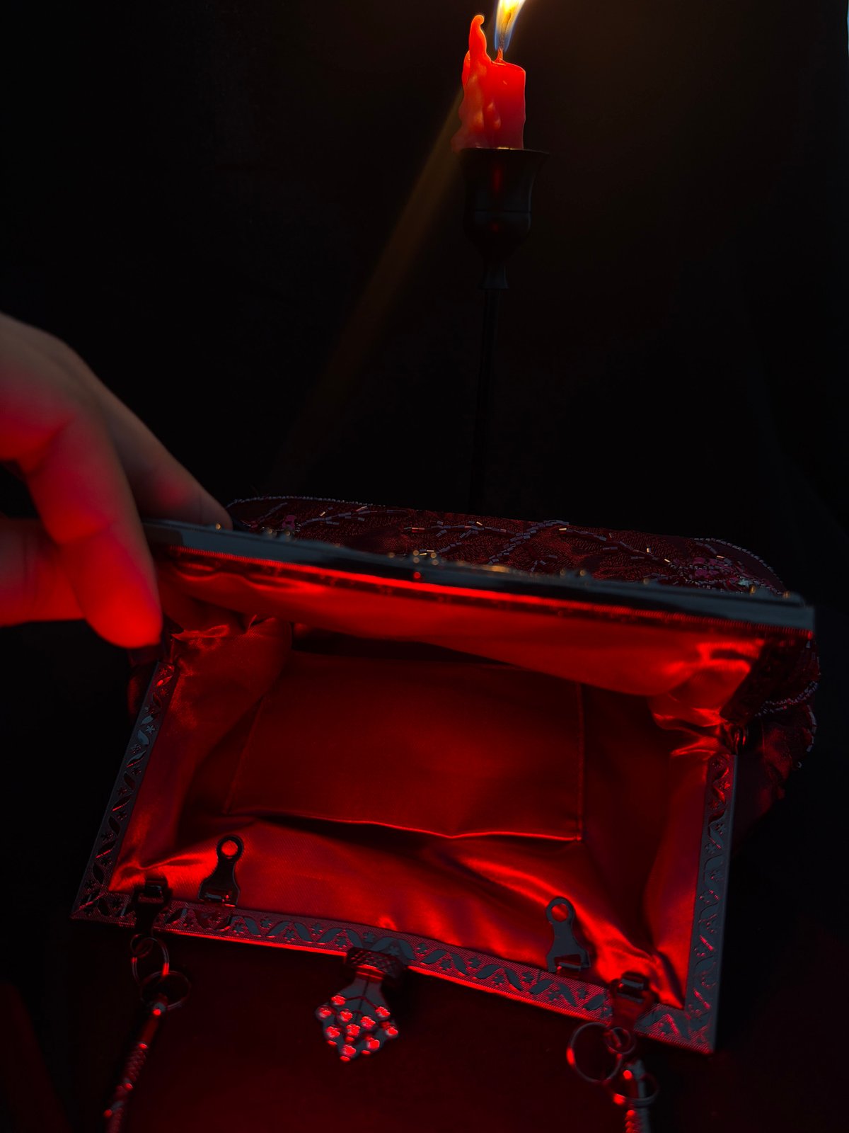 Red candles, incense, and dark aesthetic objects in moody close-ups