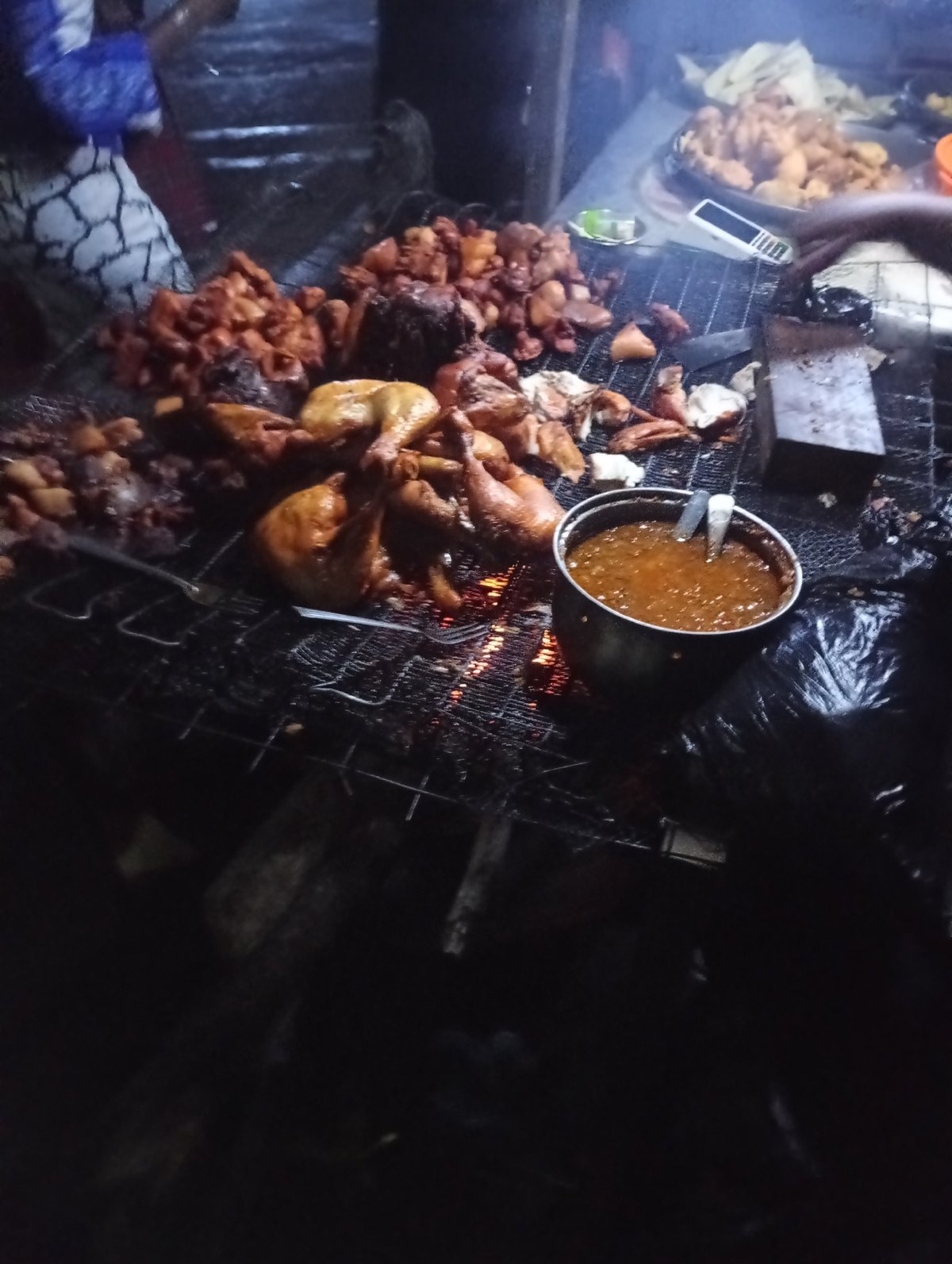 Night food stall buzzing in Nkpor, Nigeria