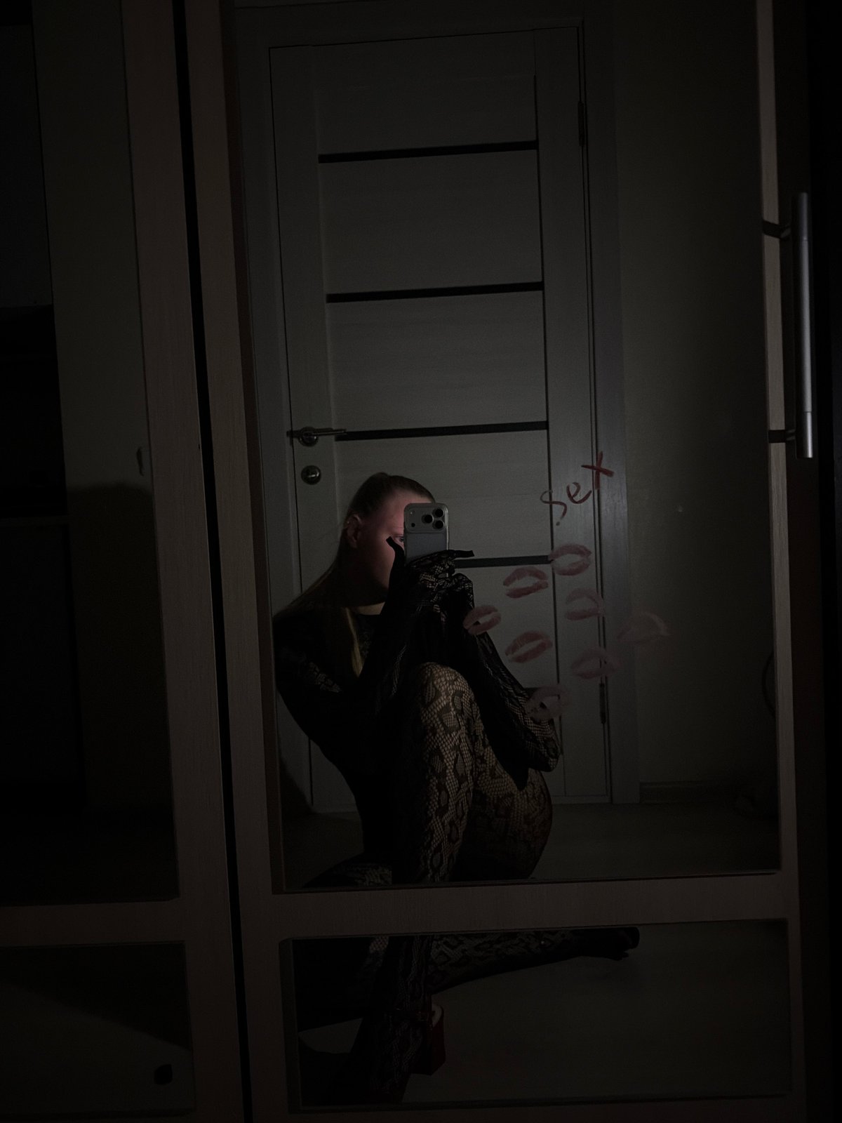 Indoor mirror selfies captured across two Russian cities