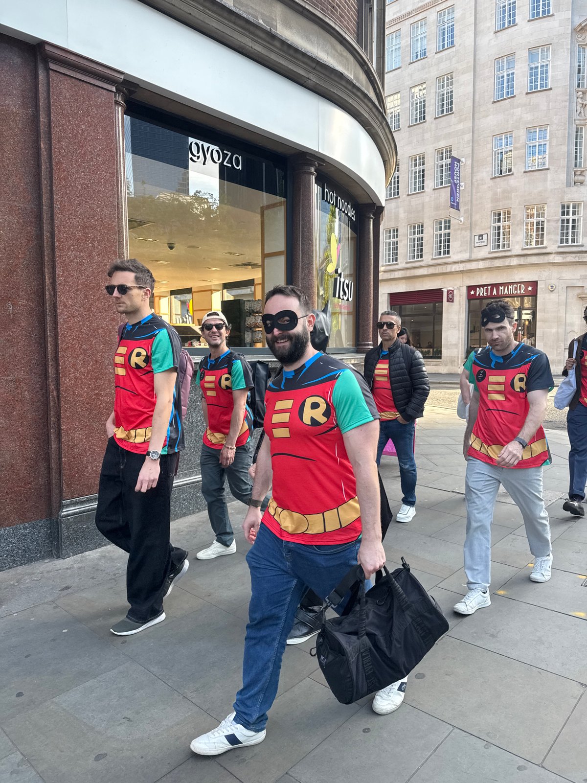 Five Robin costumed figures spotted walking London streets