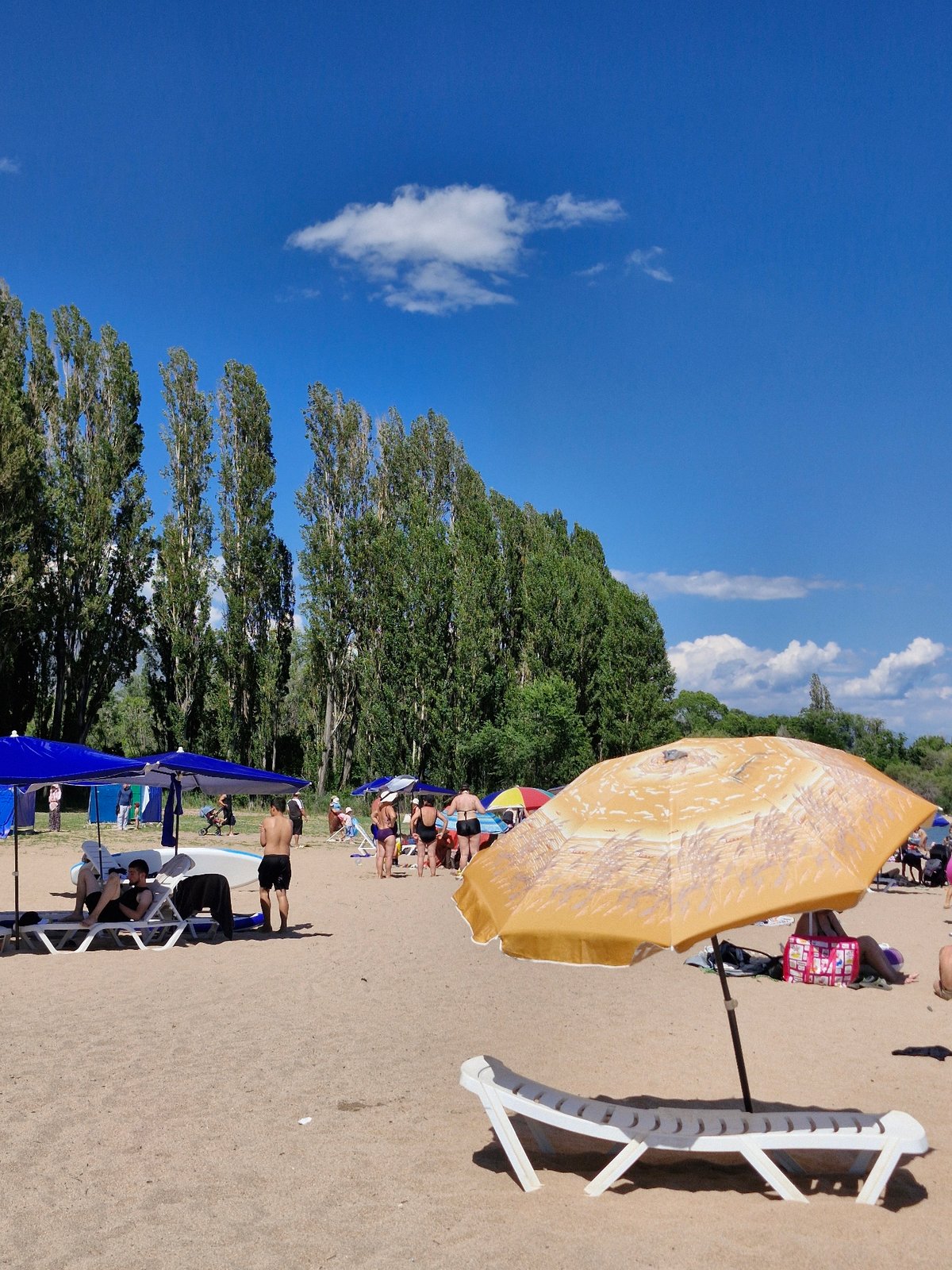 Sunny beach day on Issyk-Kul's shore in Kyrgyzstan