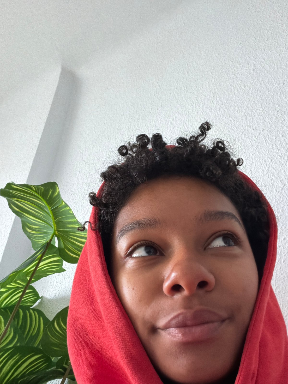 Person in red hoodie, handwritten self-care notes documented in Rubí