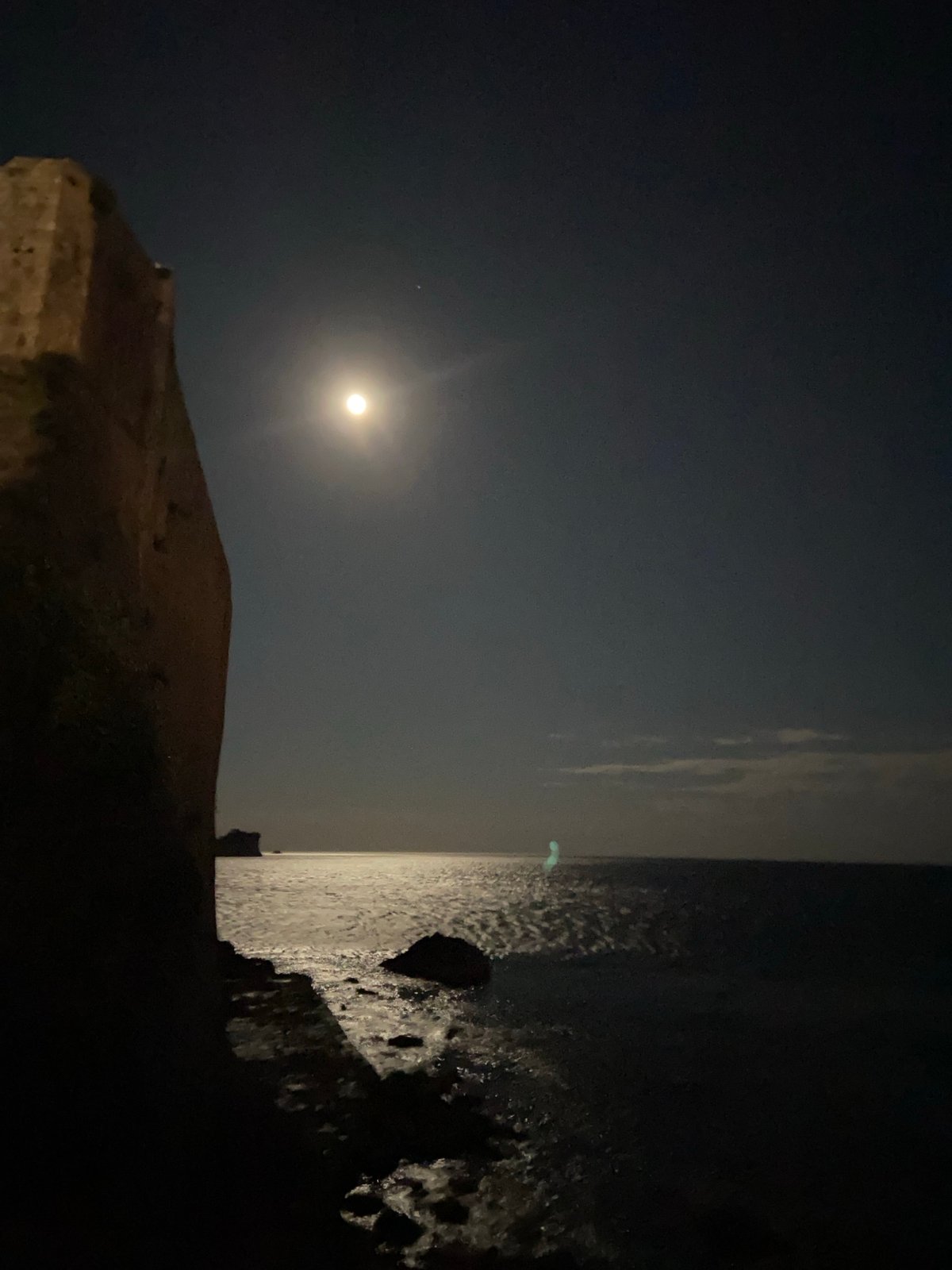 Nearly full moon illuminates Budva coastline at night