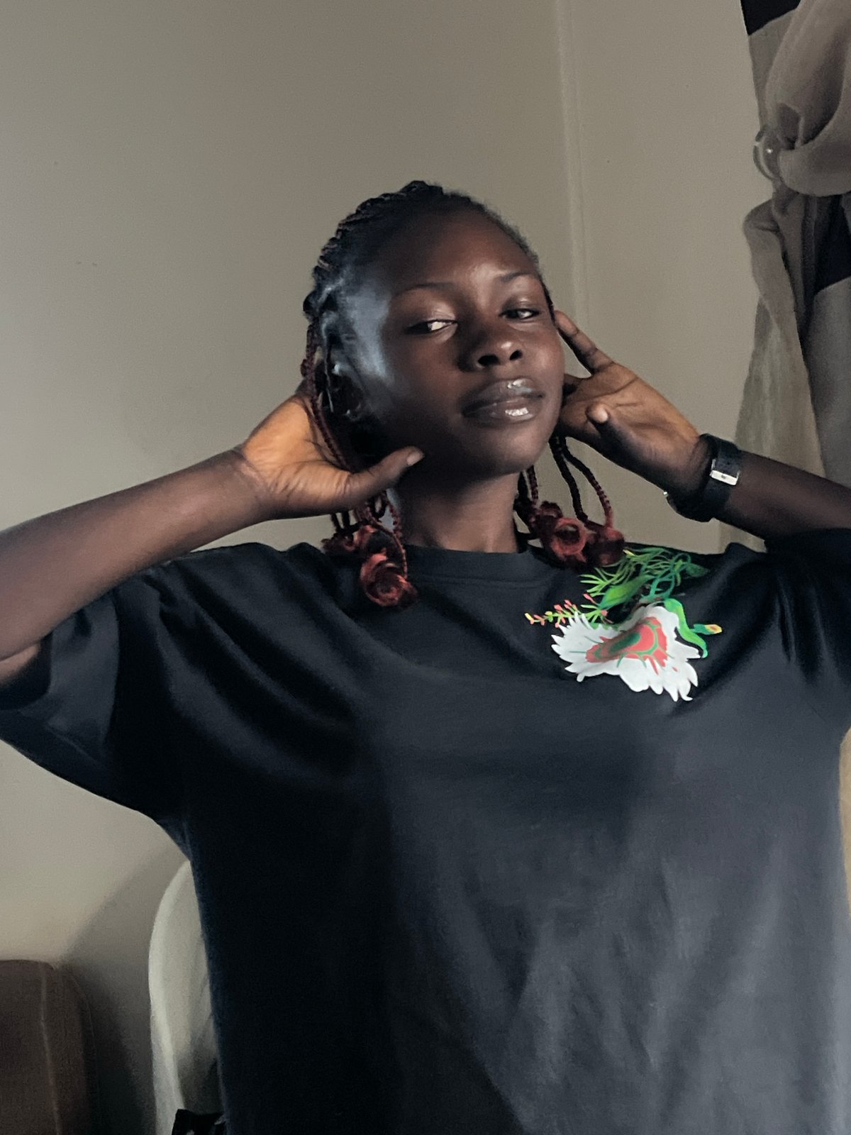 Indoor portrait session near a window overlooking Jos, Nigeria