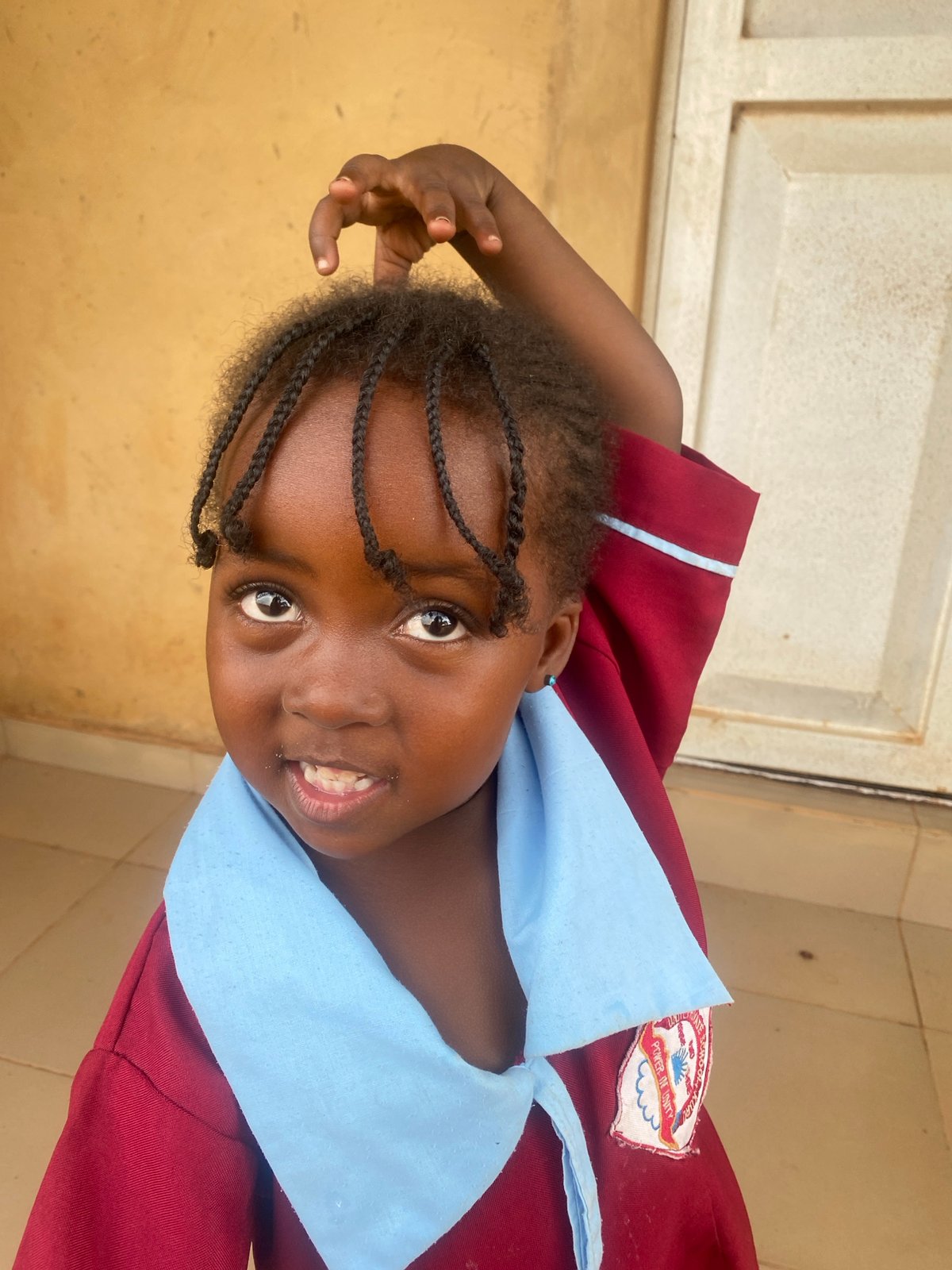 Smiling schoolgirl photographed in Kuru Dungus, Nigeria