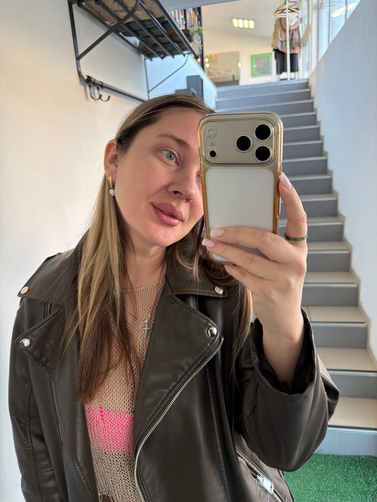 Woman takes mirror selfies indoors in Chaikovsky, Russia