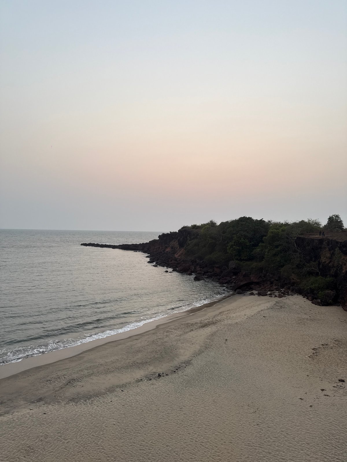 Tourist captures coastal views at Querim beach, Goa