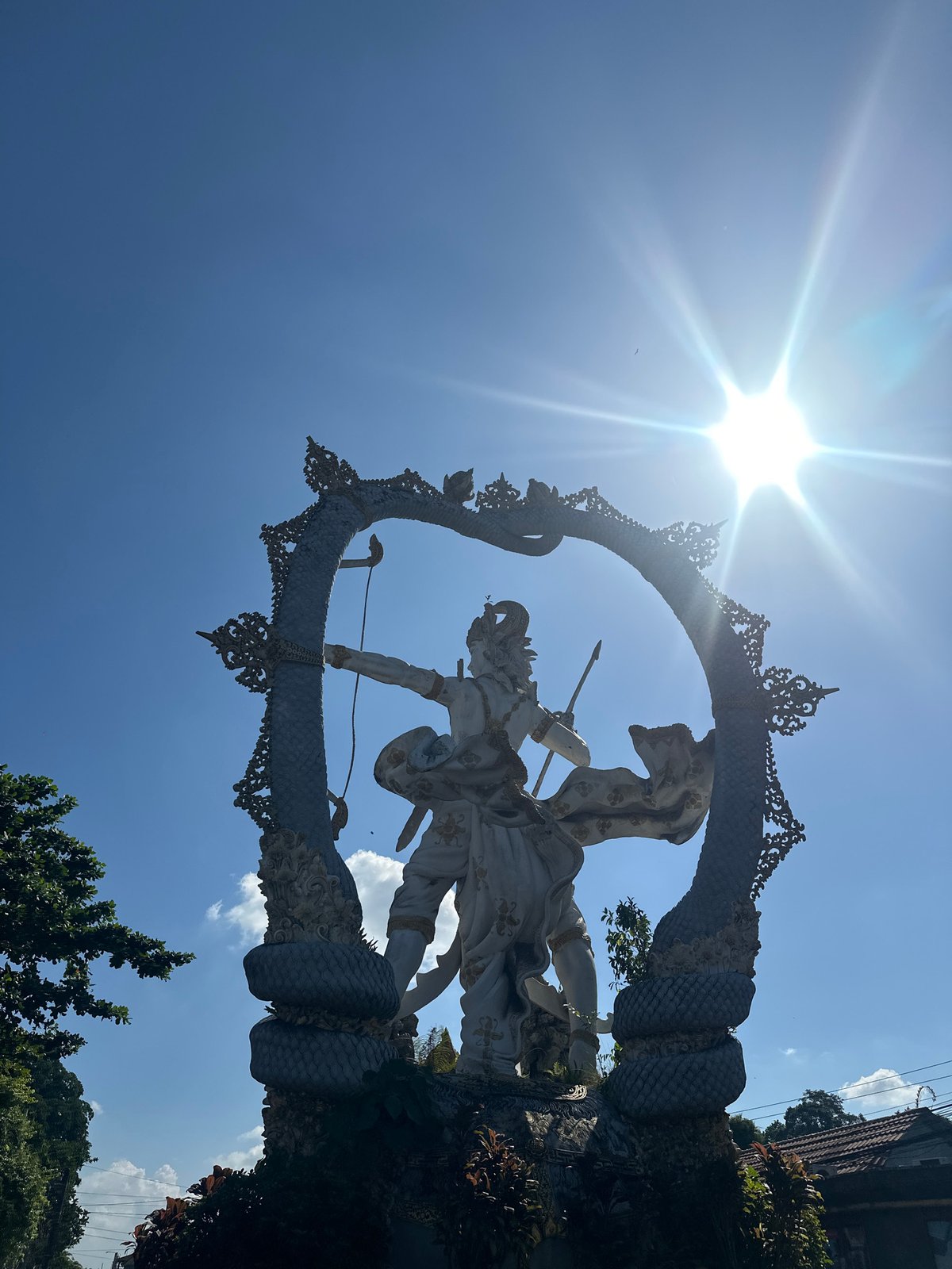 Arjuna statue and street life in Ubud District