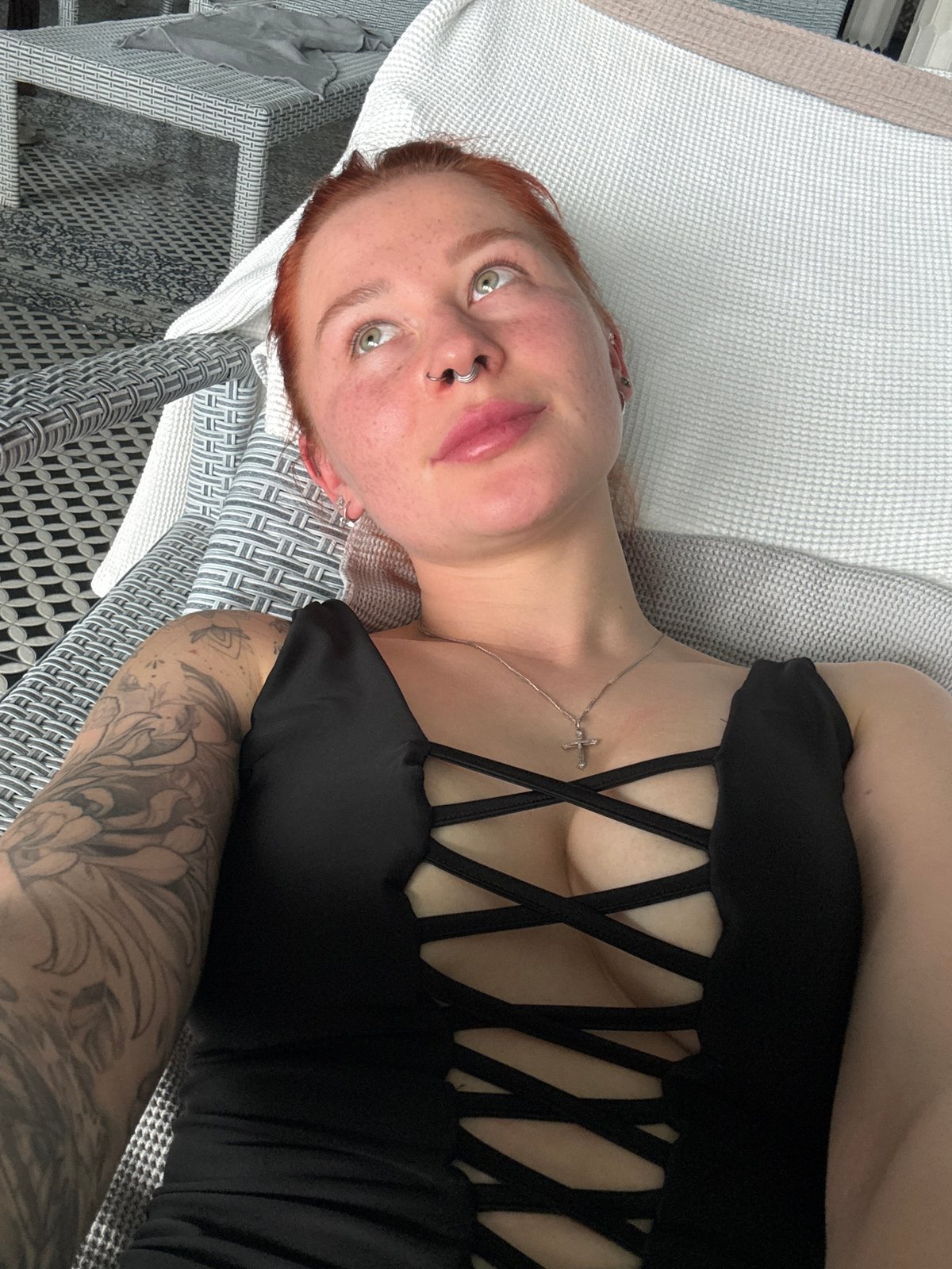Red-haired woman photographed relaxing on outdoor furniture in Rostov-on-Don