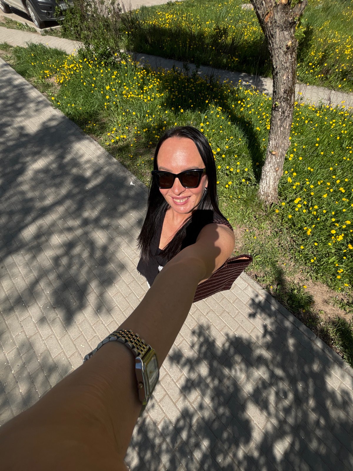 Woman documents spring morning walk through blooming Chaikovsky parks