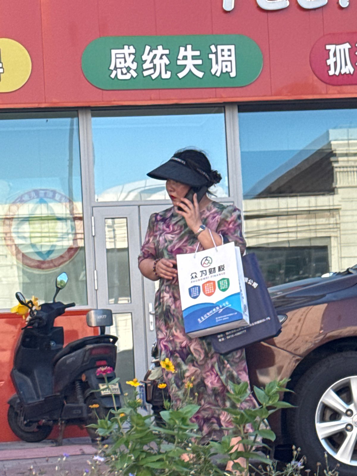 Street-level moment outside a Guta storefront, mid-morning