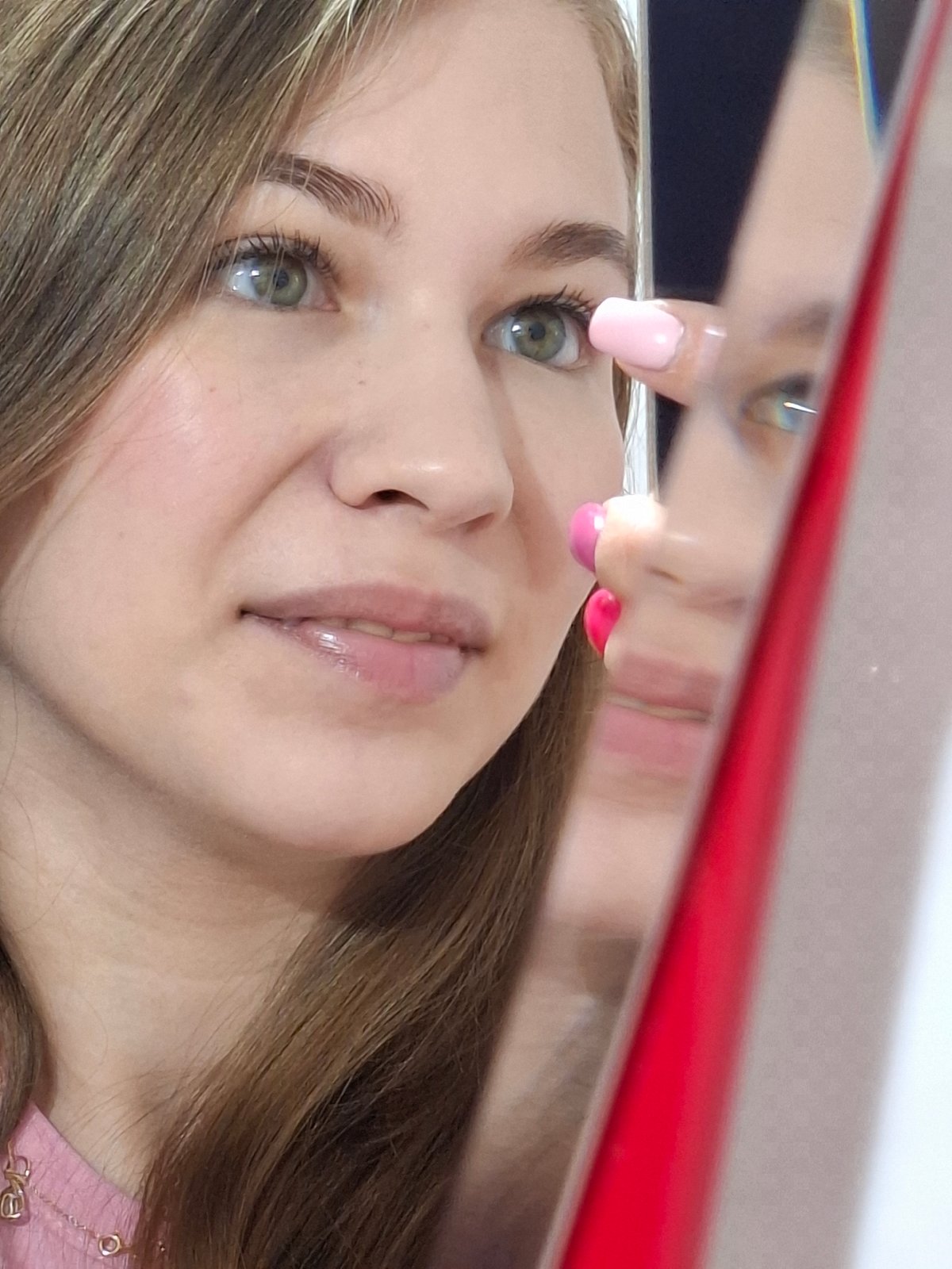 Woman Takes Selfie with Multi-Camera Phone in Chaikovsky