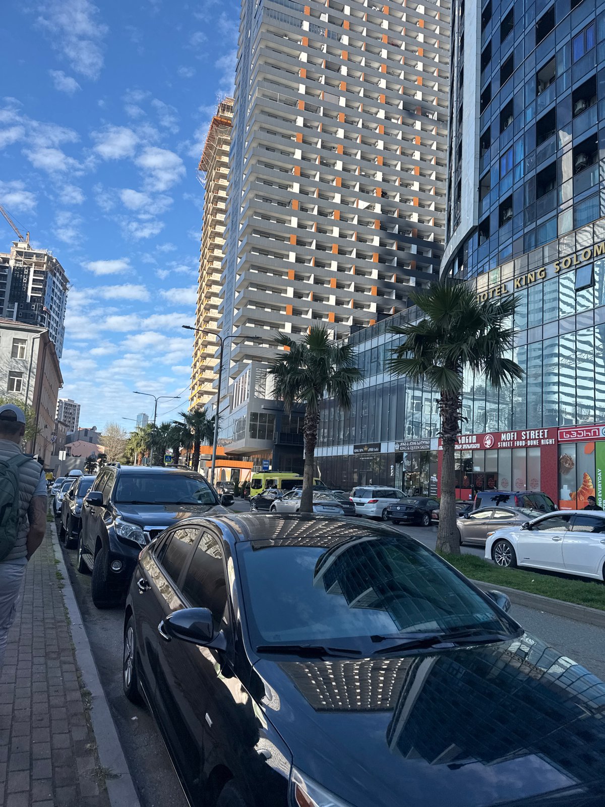 Routine city life documented across urban district April afternoon