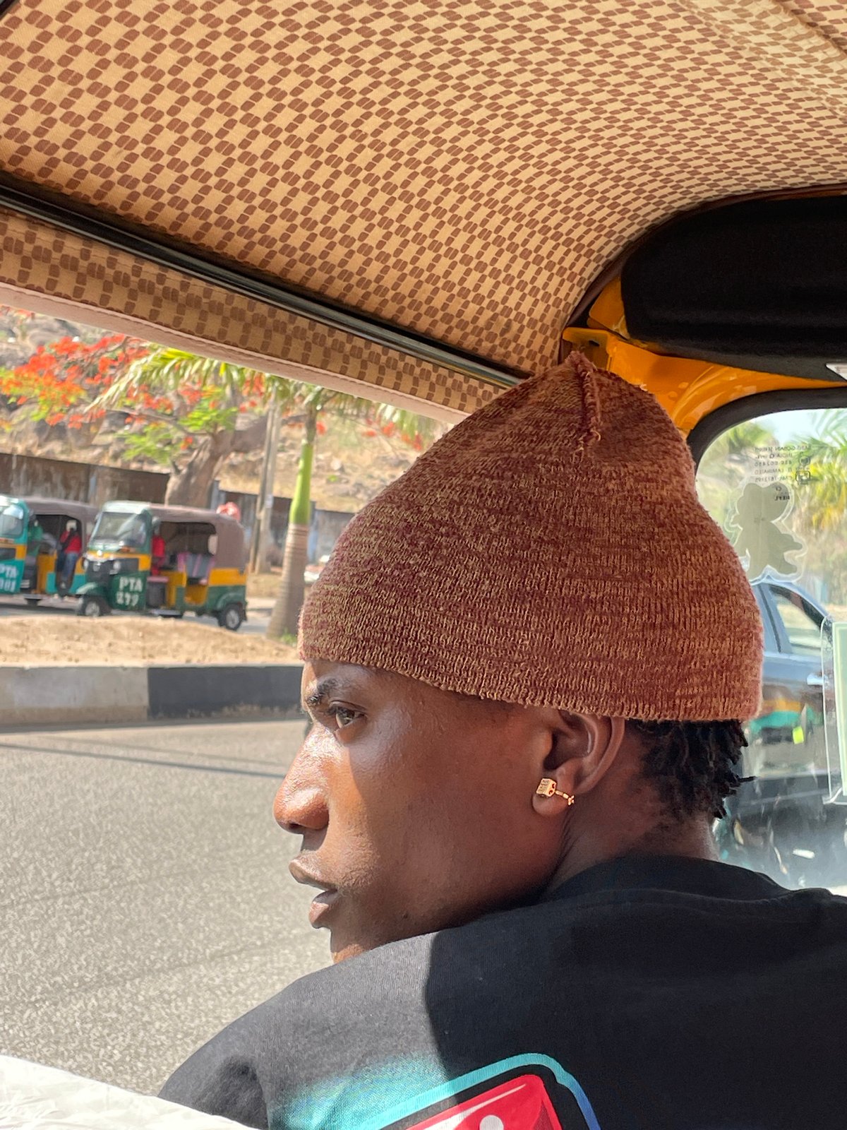Ordinary street life documented across Jos, Nigeria during afternoon hours