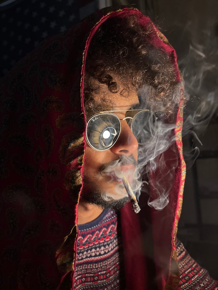 Person documented smoking across Tangier during evening hour