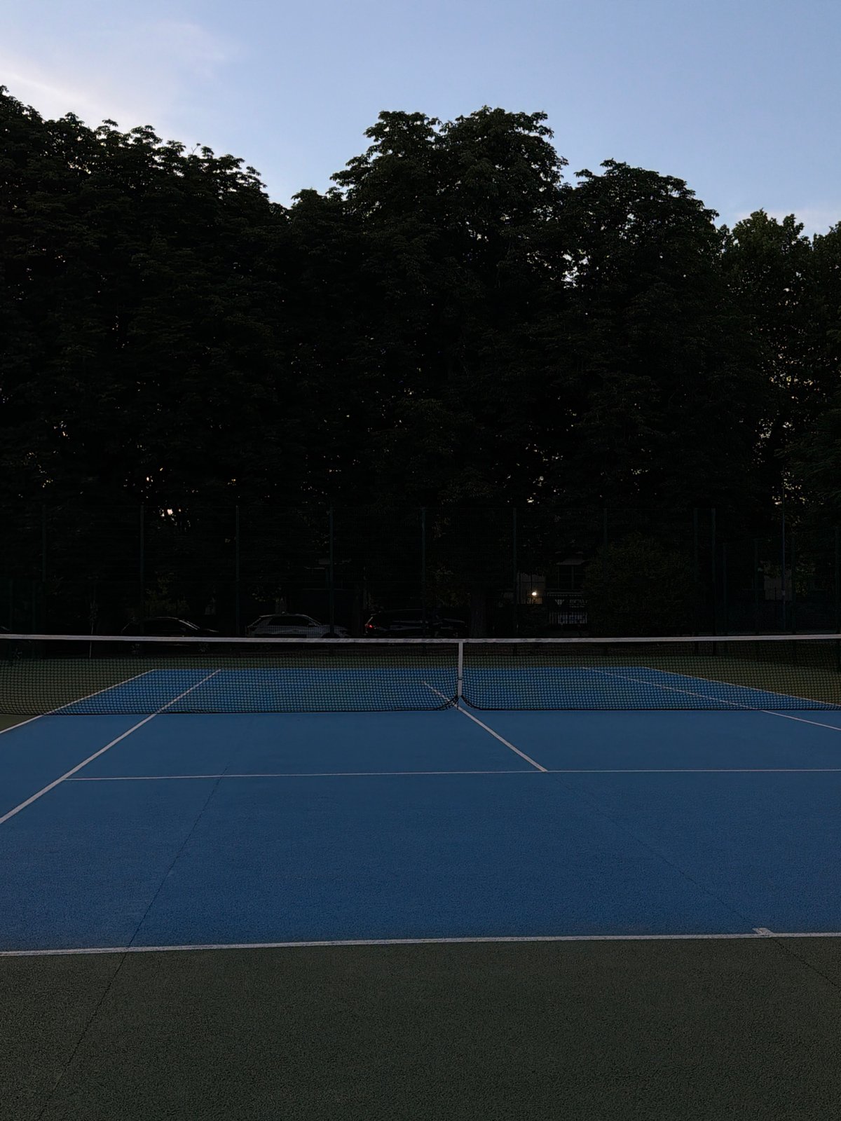 Tennis court in Santiago de Compostela, gear and equipment laid out