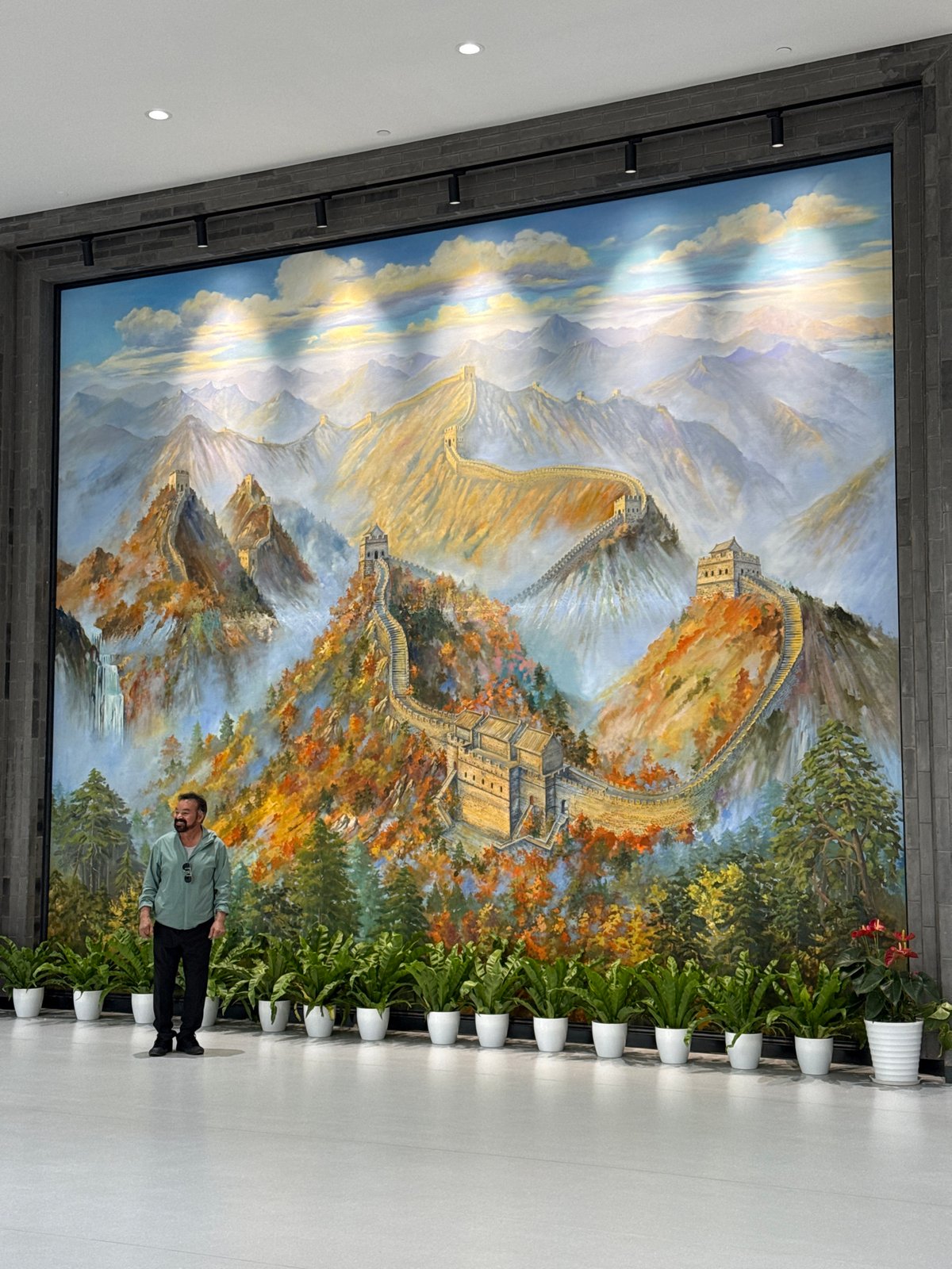 Tourists explore Great Wall visitor center with interactive displays
