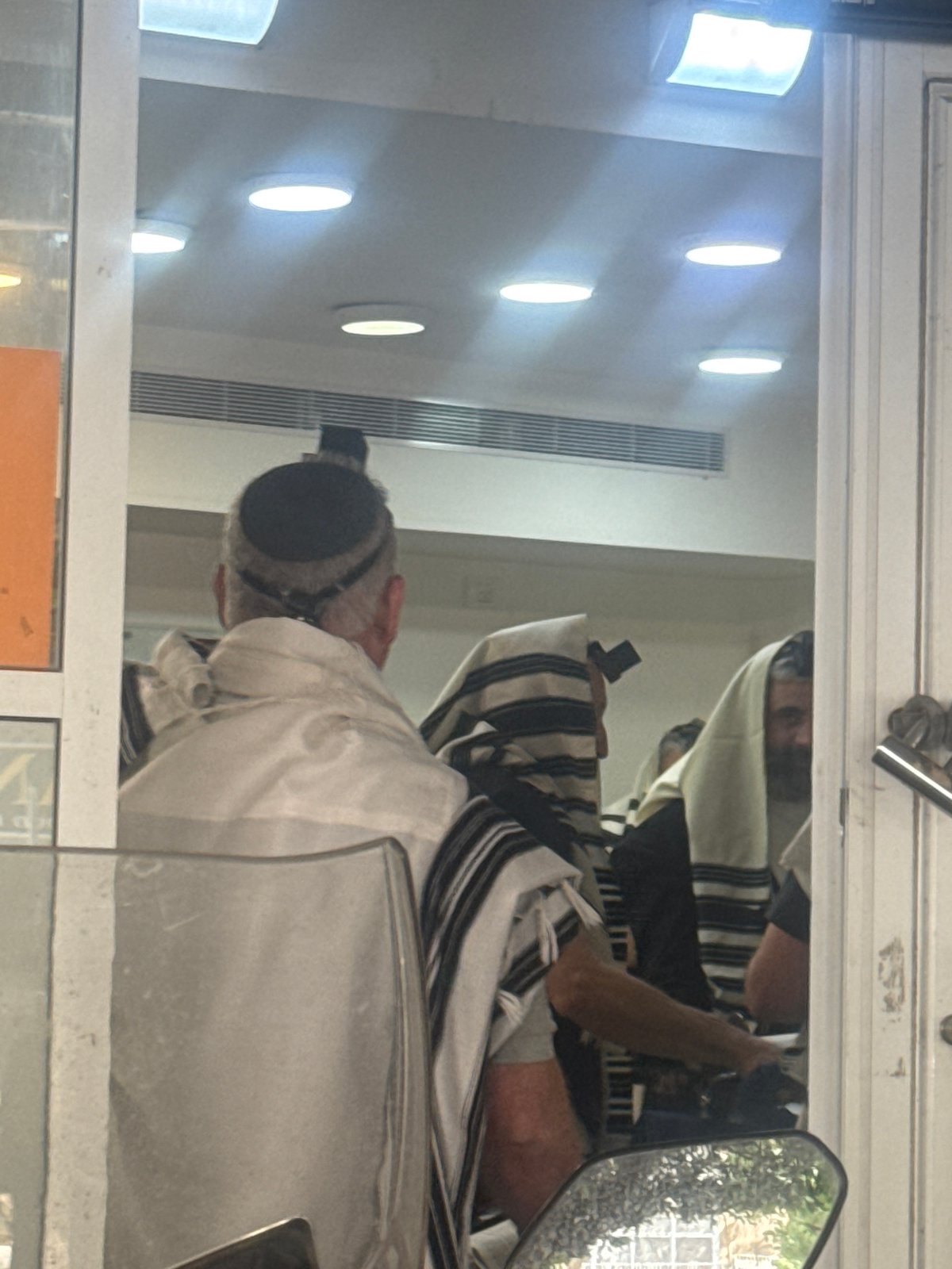 Morning prayers observed in Givatayim with traditional Jewish worship