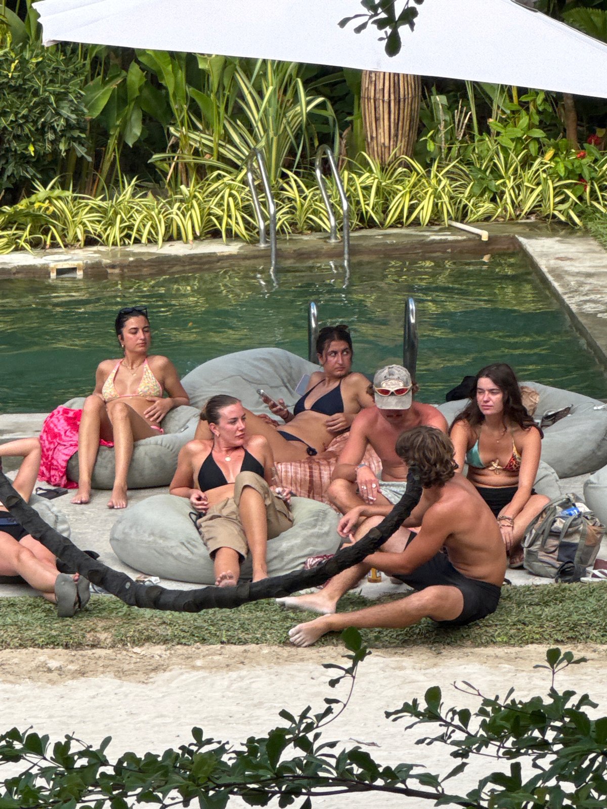 Poolside gathering captured in General Luna, Philippines morning scene