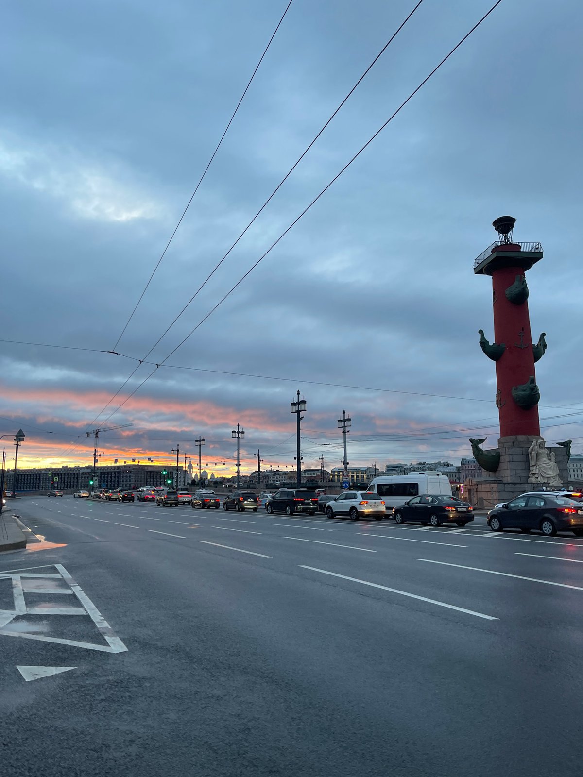 Saint Petersburg at dusk: wet streets, dancing, and a dramatic sky