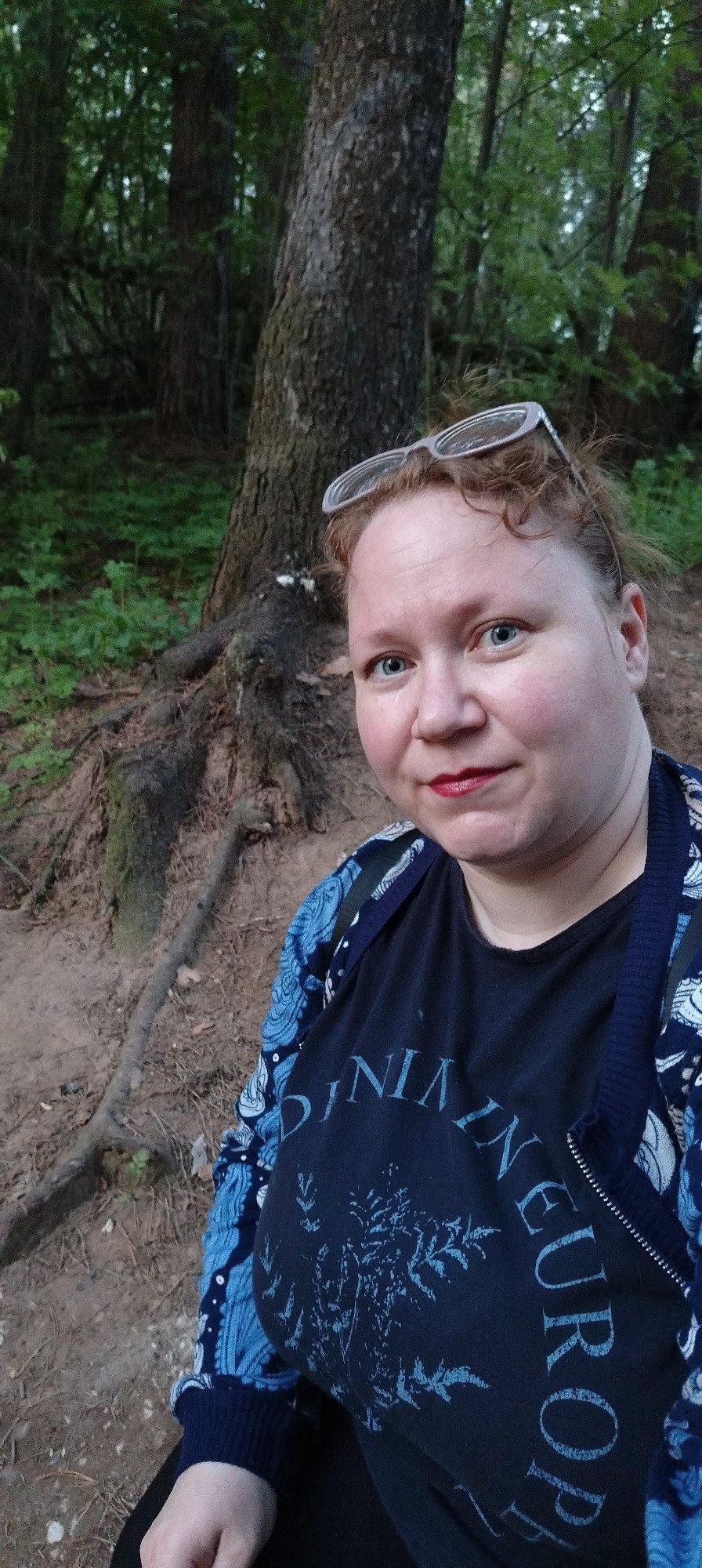 Woman documents spring blooms during afternoon walk in Chaikovsky