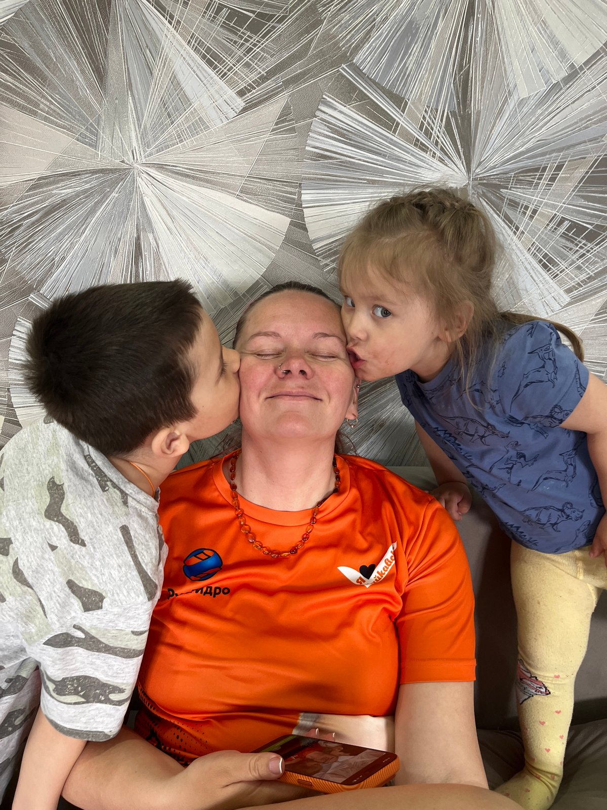 Family moment captured indoors in Chaikovsky, Russia
