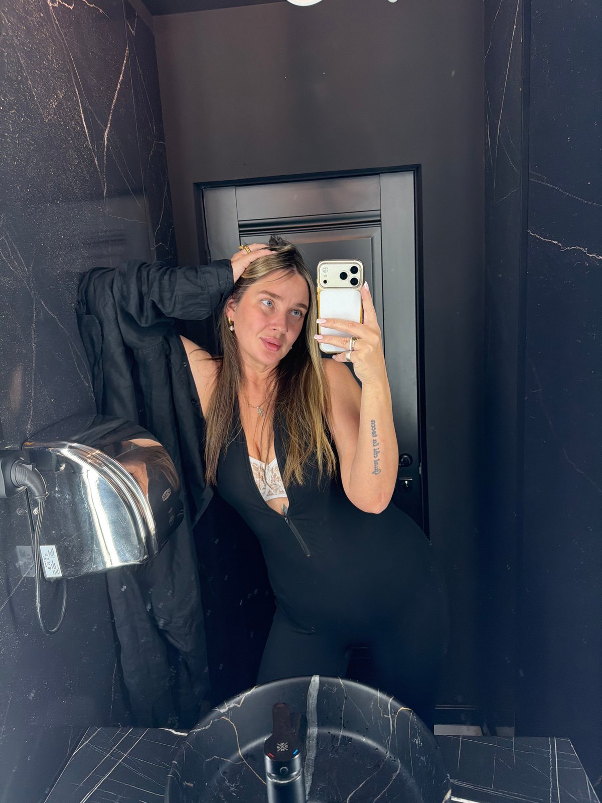 Woman takes selfies in upscale Moscow bathroom over afternoon