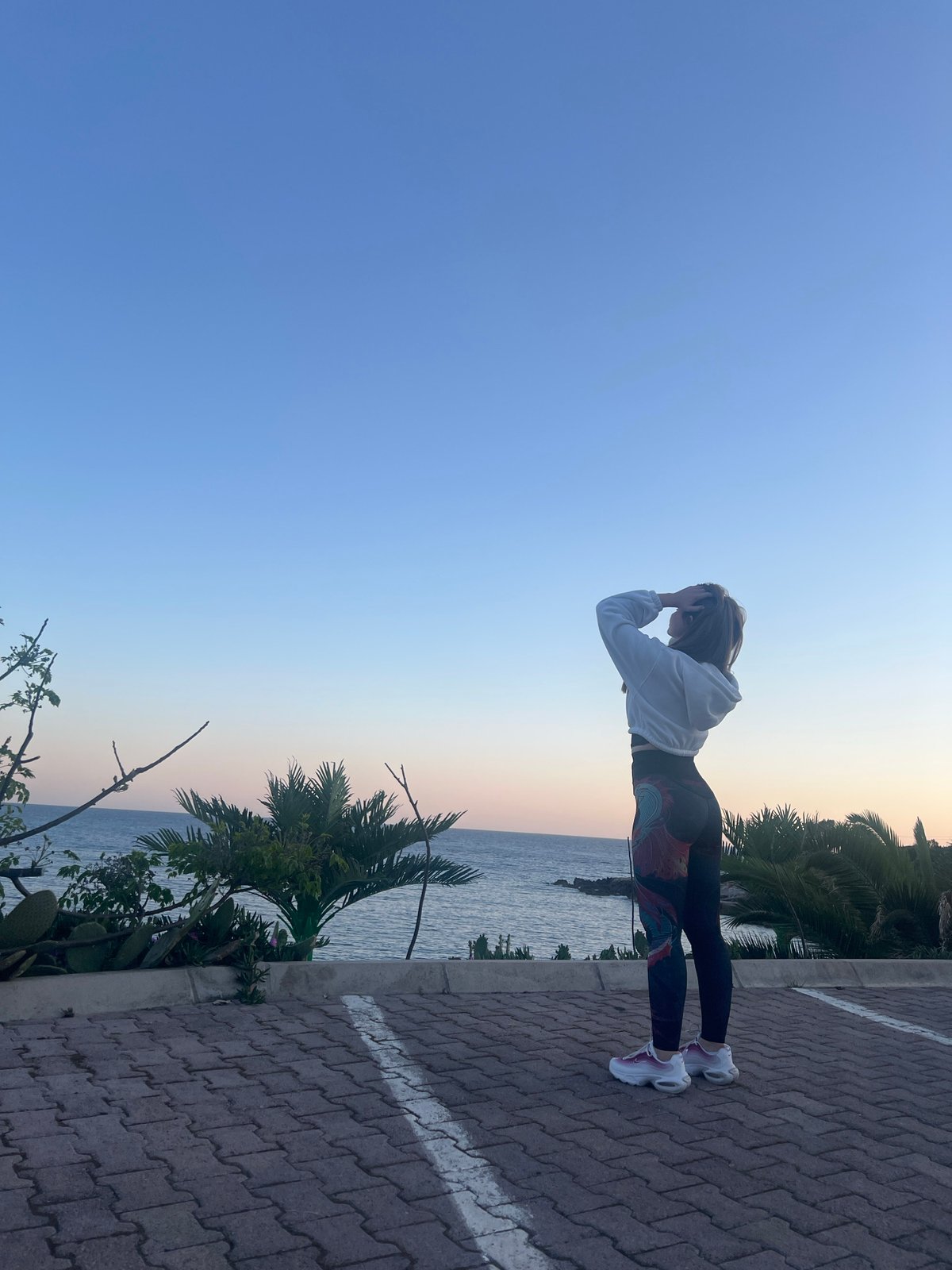 Woman captures coastal sunset memories in Montenegro seaside town