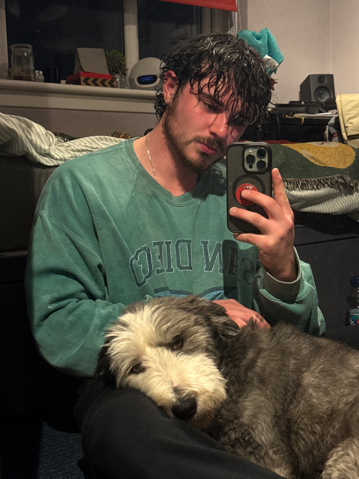 Man takes selfies with dog and in mirror