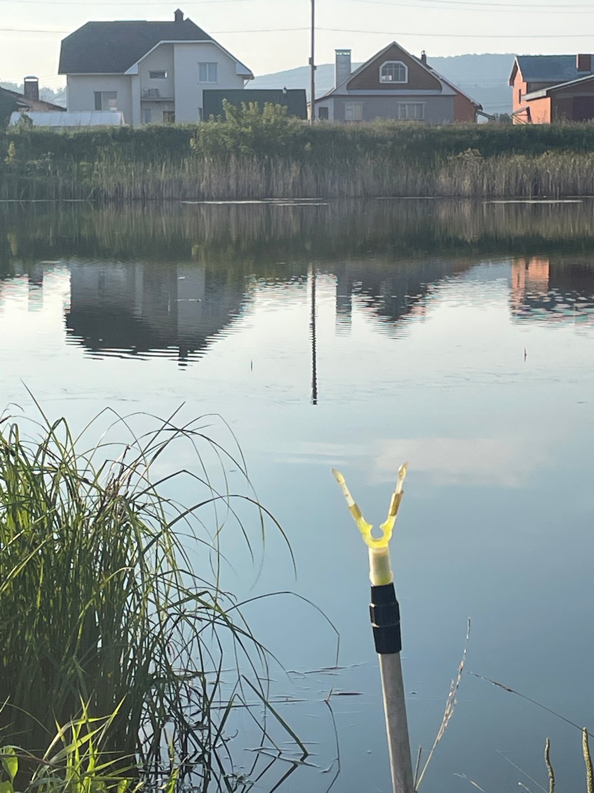 Early morning fishing session on a calm Oktyabrsky waterway