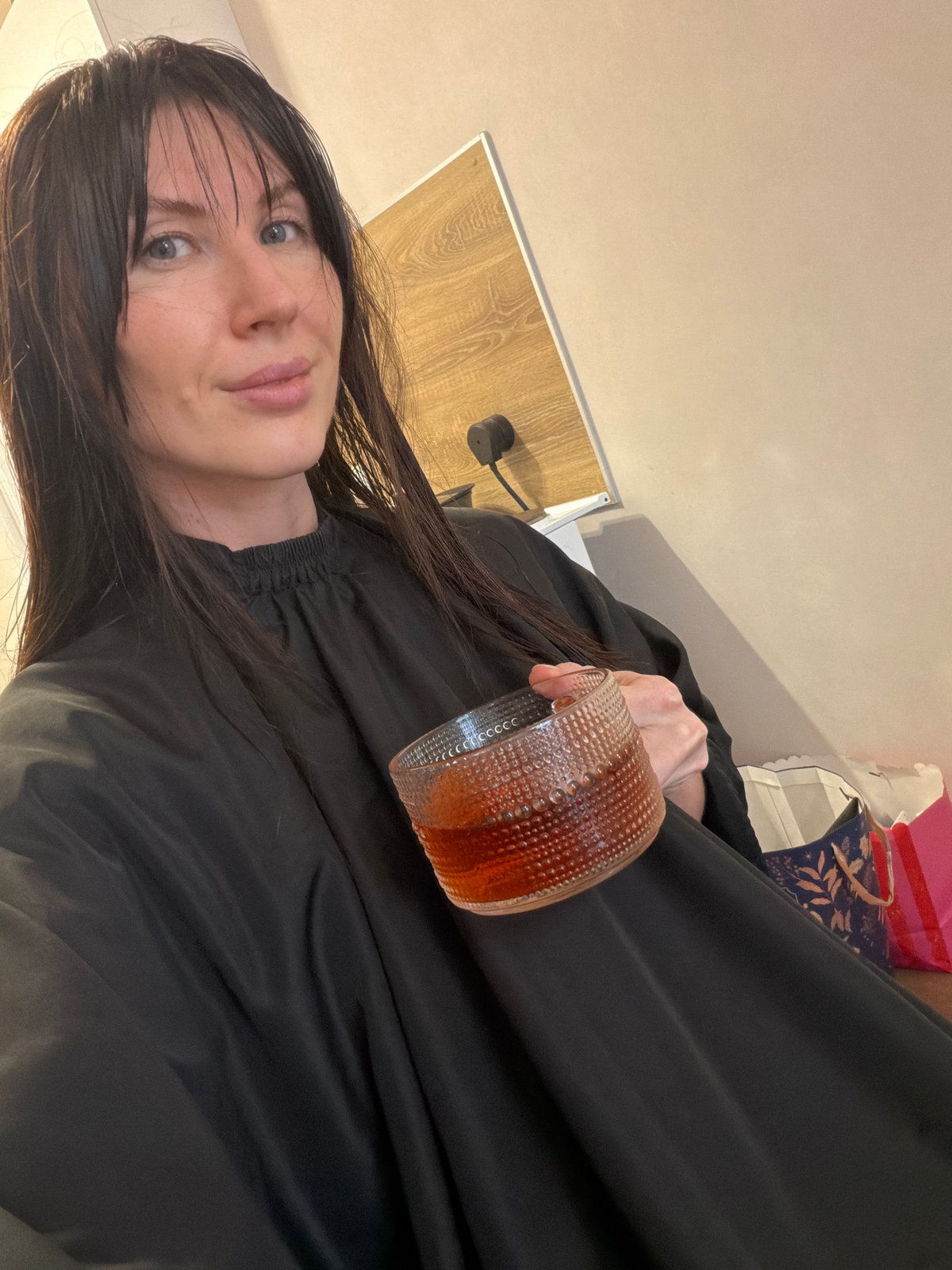 Woman gets hair styled at salon in Perm, Russia